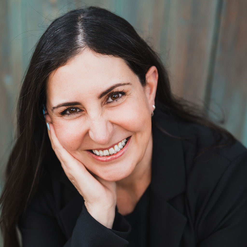 Woman in a black coat with a blurred background