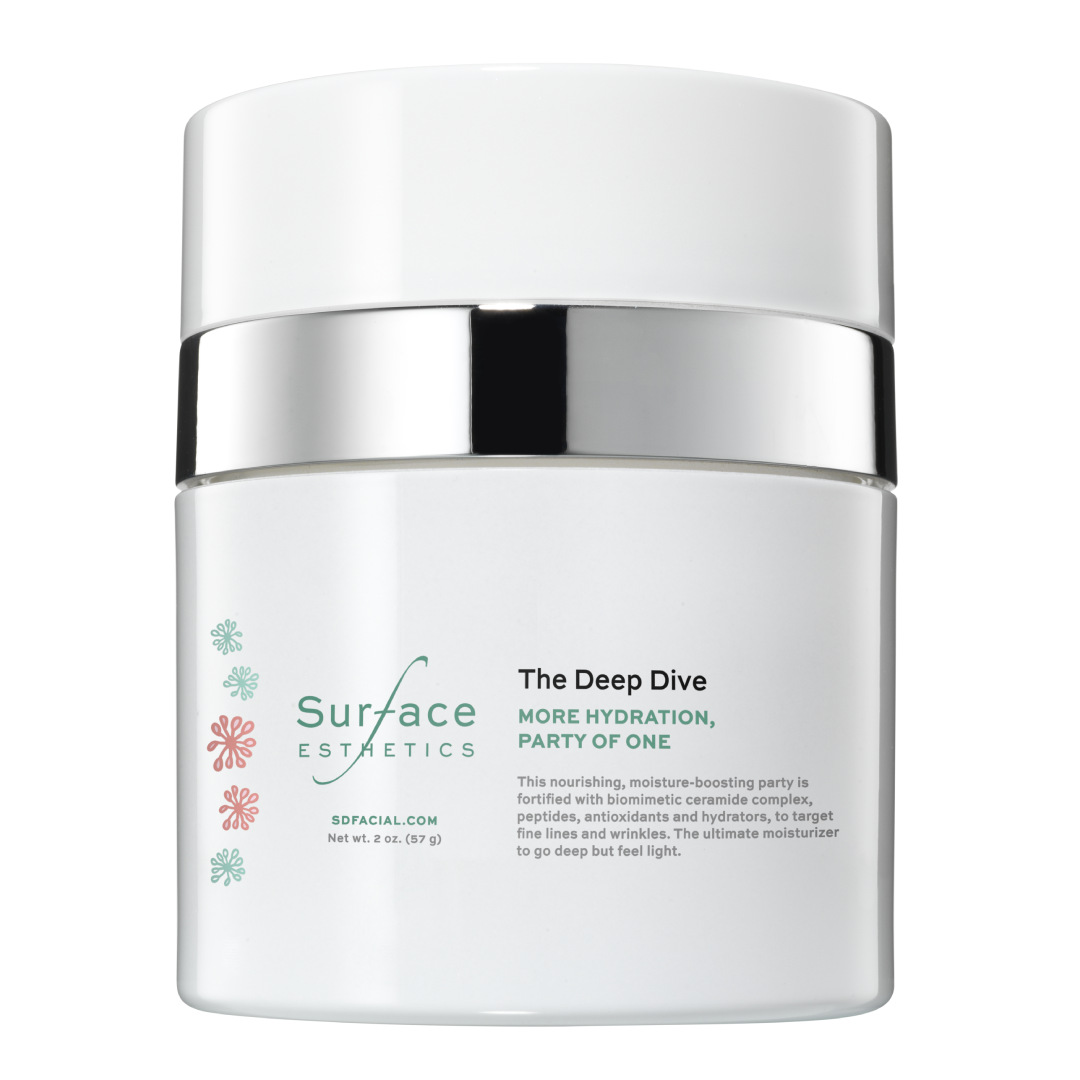 Skincare jar labeled 'The Deep Dive' by Surface Esthetics on a white background