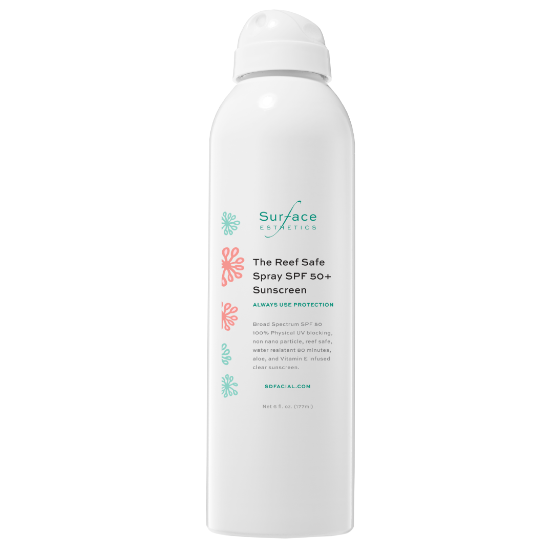 White sunscreen spray bottle with 'Surface' branding on a white background