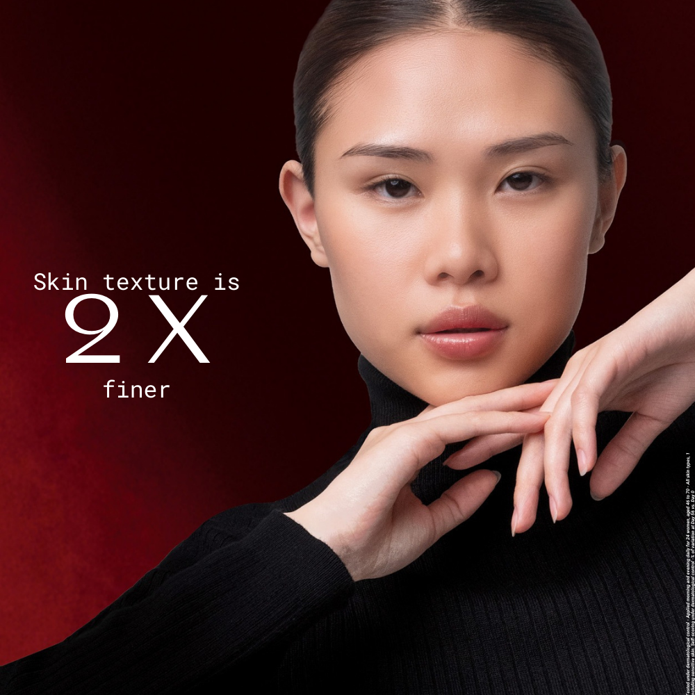 Woman with smooth skin texture on a dark background with text 'Skin texture is 2X finer'.