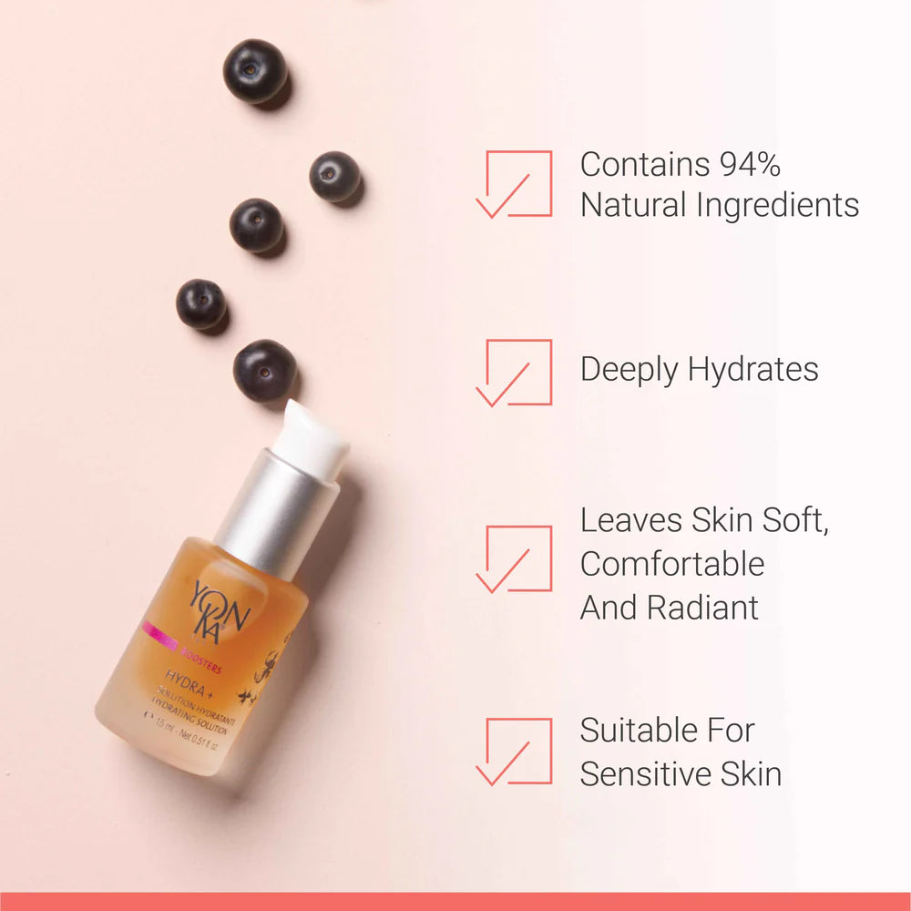 Skincare serum bottle with blueberries on a light pink background, featuring text about product benefits.