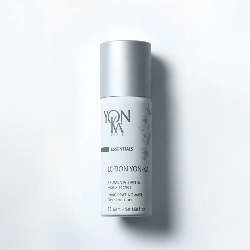 Yon-Ka lotion bottle on a light gray background